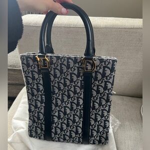 Vintage Dior navy bag with Dior prints and Gold hardware. In perfect condition.